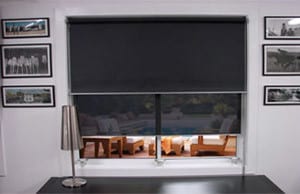 black dual roller blinds in a living room