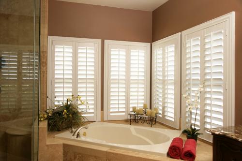 white plantation shutters in a bathroom