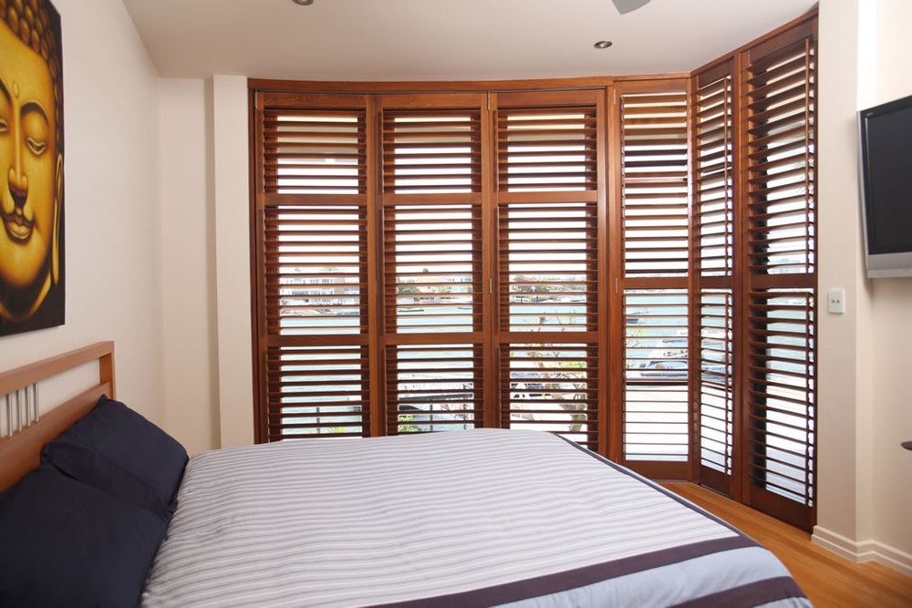 cedar shutters in a bedroom