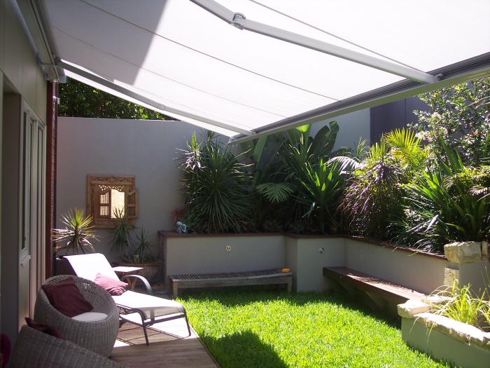 folding arm awnings overlooking an outdoor area