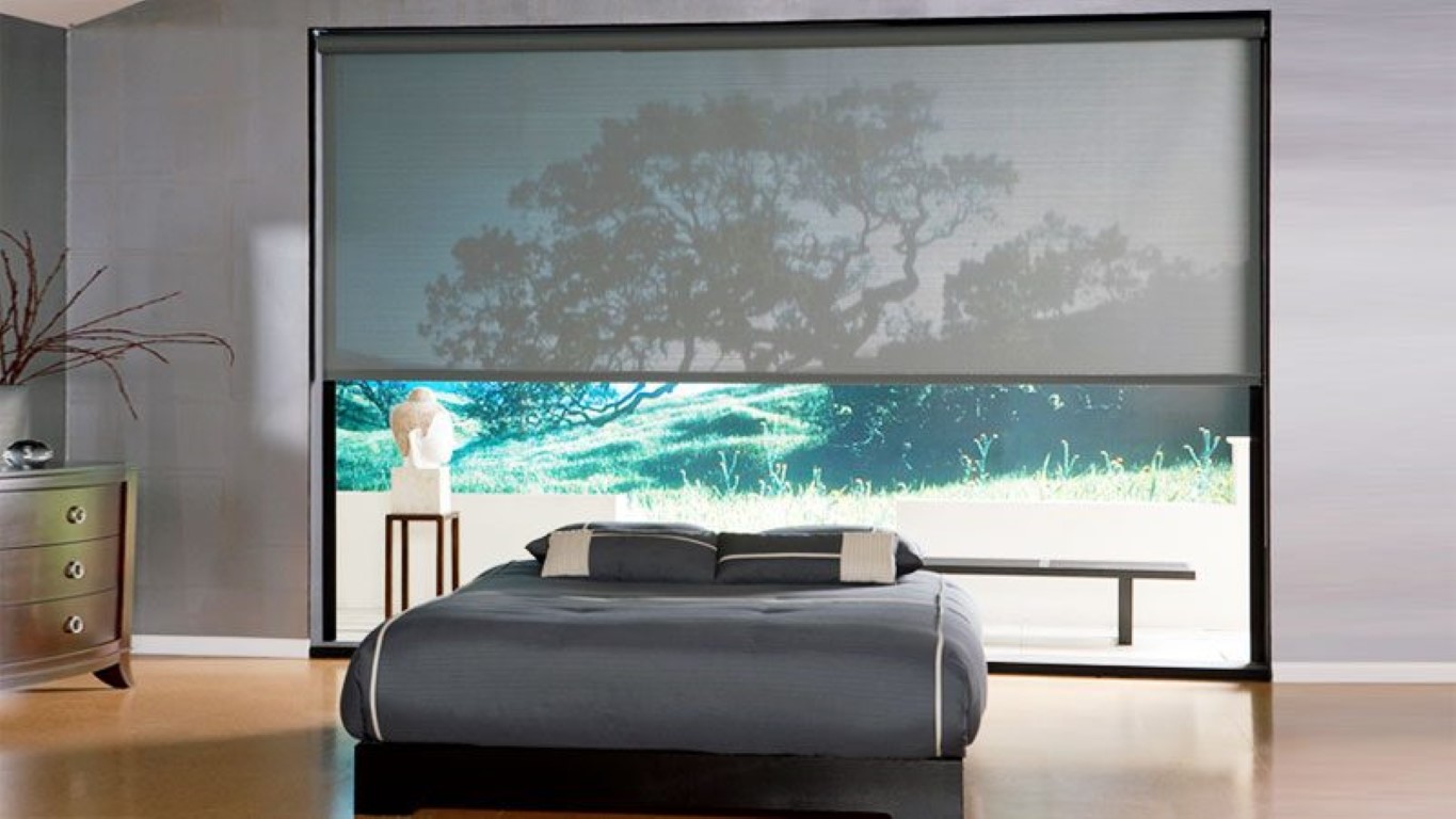 sunscreen roller blinds in a bedroom